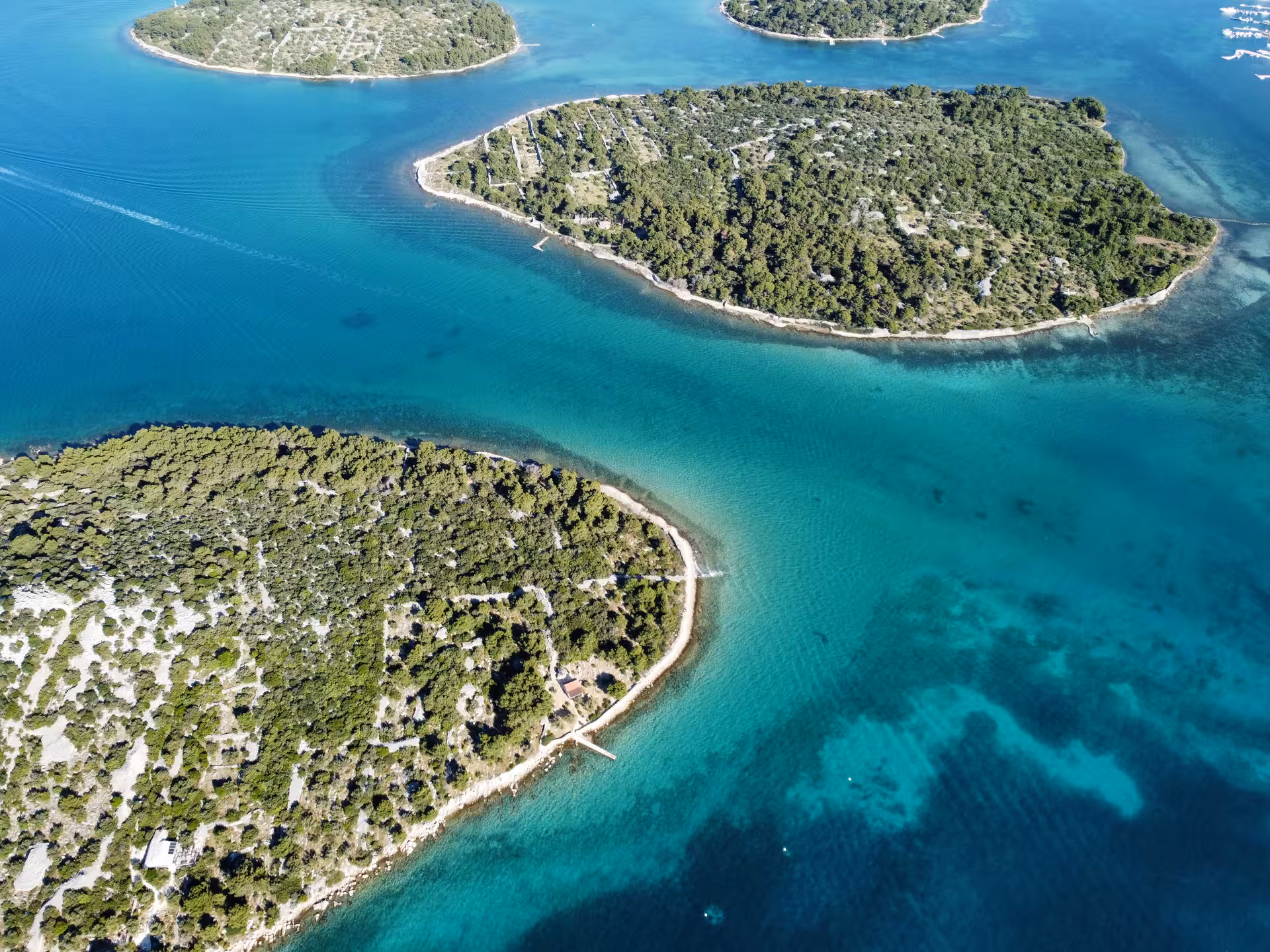 Aerial view of Adriatic islets and turquoise lagoons, perfect for Dolce far niente island-hopping cruise
