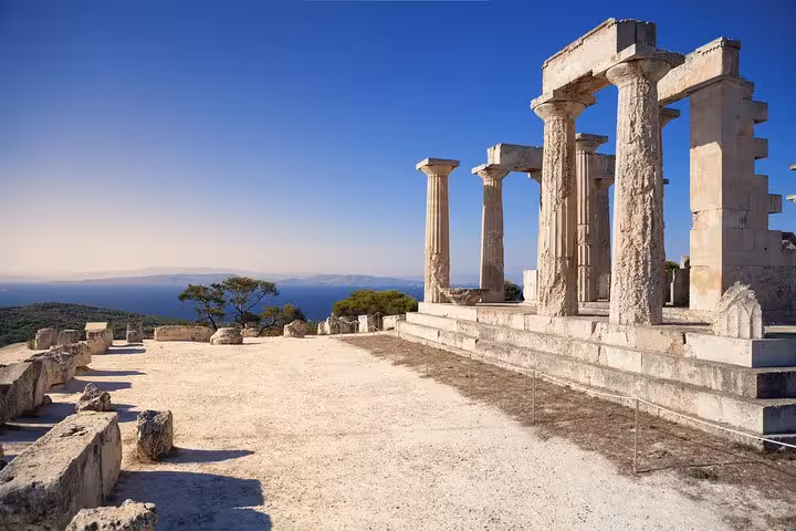 Ancient Greek temple ruins on Aegina island visit during Athens all-day Saronic Gulf cruise with lunch