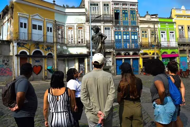 Tourists admire historic Afro-Brazilian architecture in Rio's Little Africa, highlighting vibrant cultural heritage.
