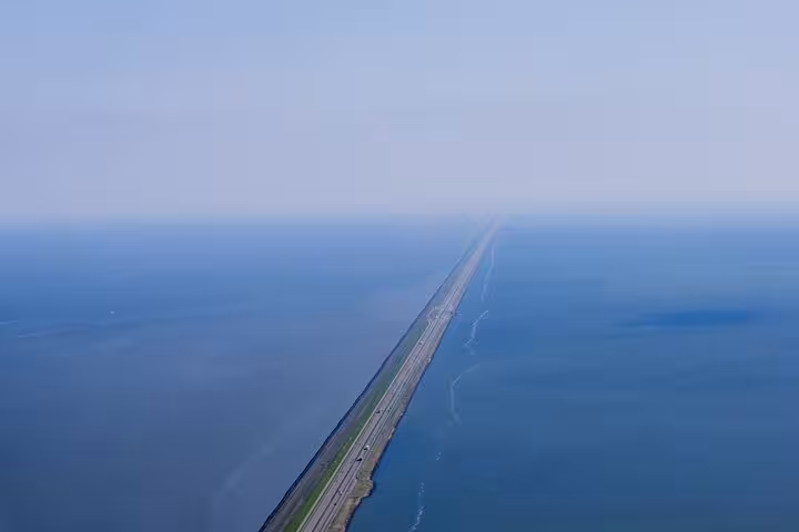 Aerial view of the Afsluitdijk causeway, a highlight on a private Amsterdam North day tour in Holland