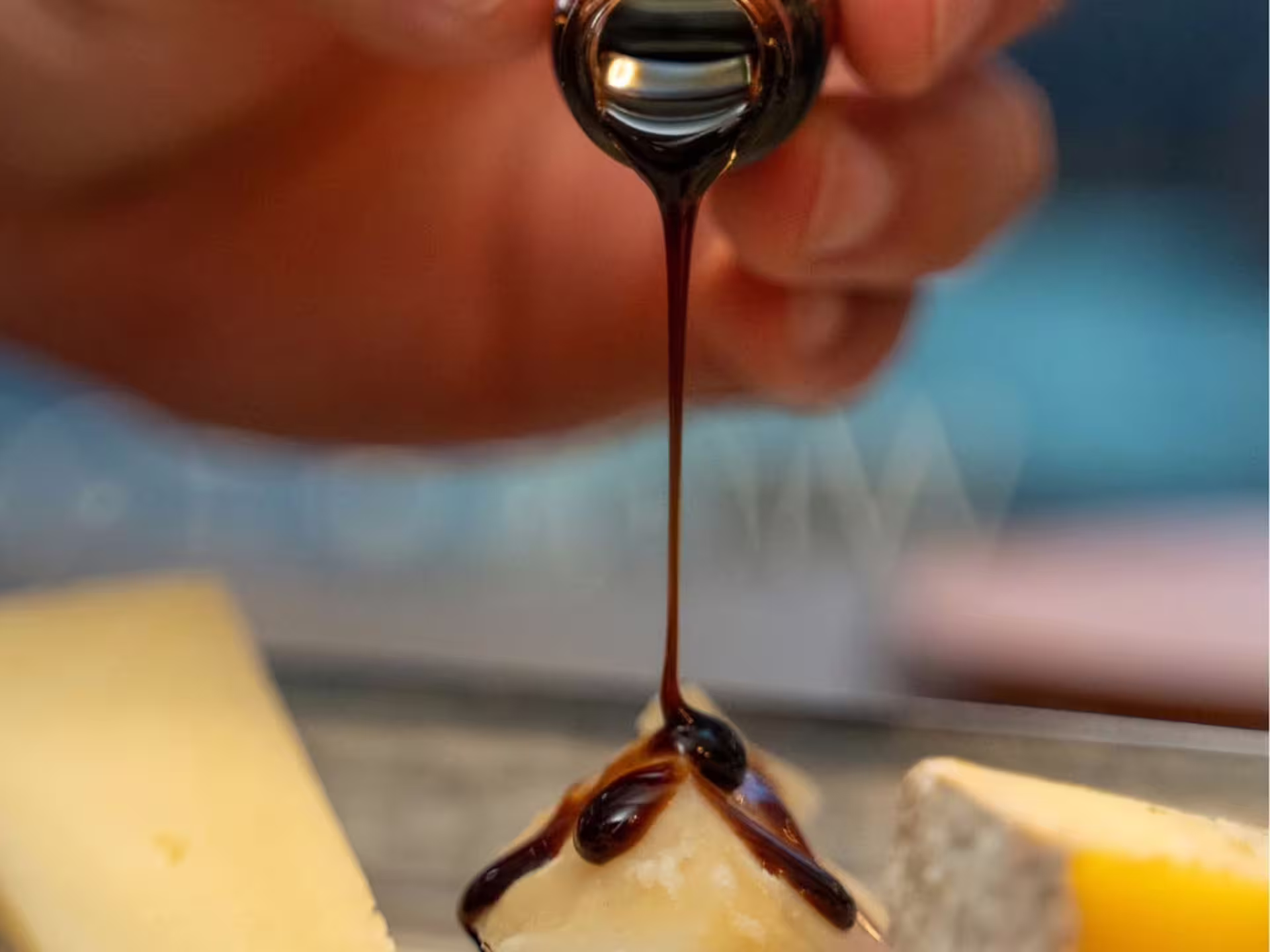 Aged cheese topped with traditional balsamic vinegar, signature pairing on Modena luxury wine tasting experience