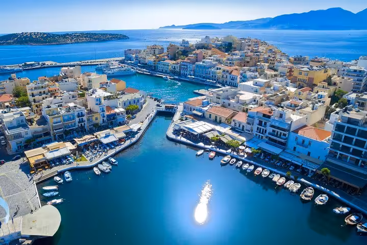 Agios Nikolaos marina and lake aerial view, eastern Crete stop on a 7-day private guided tour from Heraklion