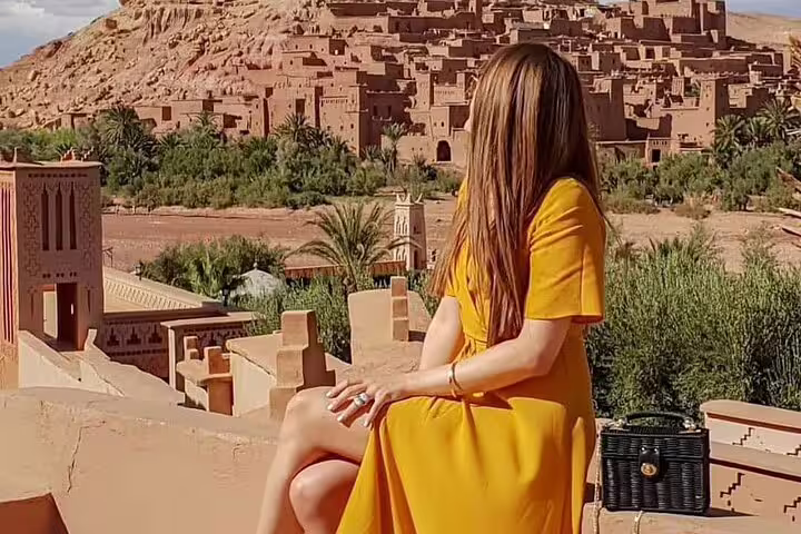 Traveler overlooks Ait Benhaddou kasbah on private 6-day desert tour from Casablanca to Marrakech