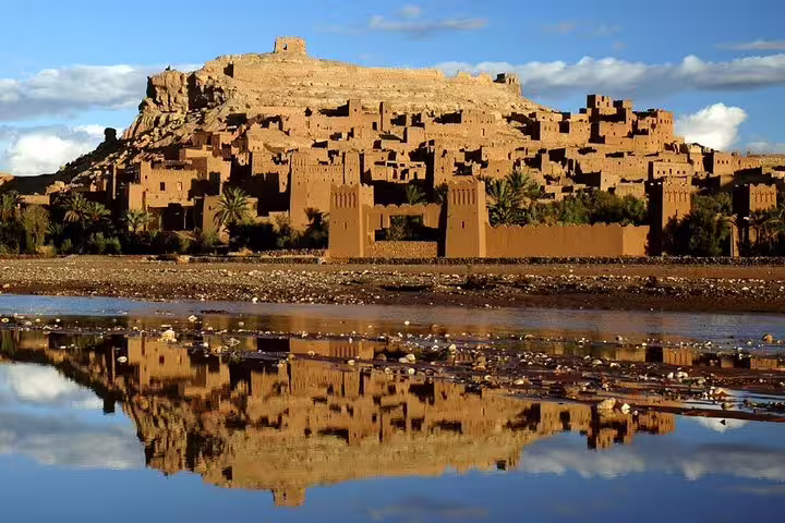 Ait Benhaddou ksar reflected in river, scenic stop on private 2-day desert tour from Marrakech to Zagora