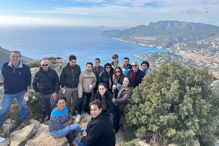 Small group at a scenic viewpoint above Cassis and Marseille coastline during full-day Aix-en-Provence tour