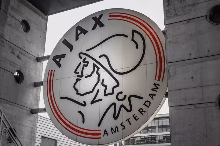Ajax Amsterdam club logo sign outside Johan Cruijff Arena, key stop on Amsterdam city highlights tour