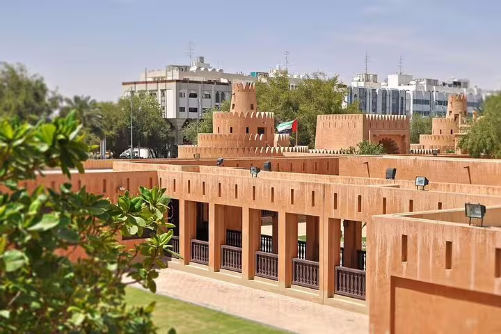 View of Al Ain's traditional fort architecture, blending heritage with modern cityscape on the garden city tour.