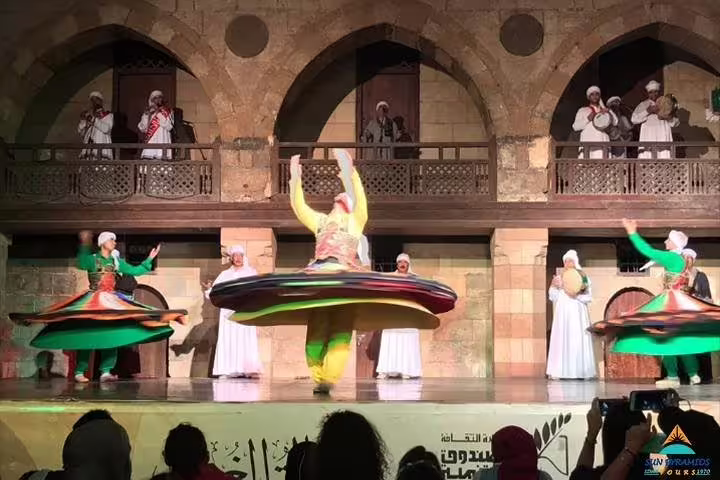 Al Tannoura Egyptian Heritage Dance Troupe Cairo show with whirling dervish skirts at historic venue
