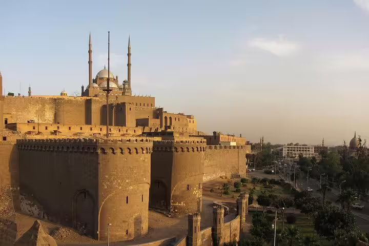 Cairo Citadel skyline with the Alabaster Mosque minarets at sunset on a private day tour from Cairo