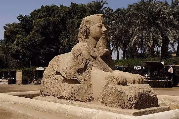 Alabaster Sphinx of Memphis in Egypt with palm trees, highlight of Dahshur Memphis Saqqara private tour