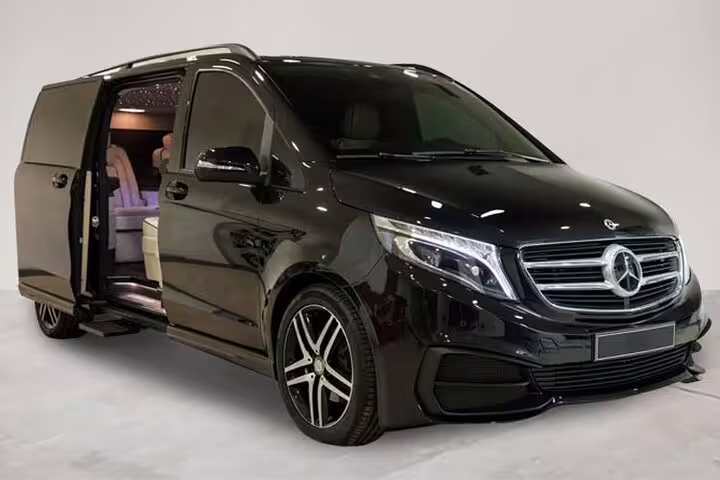 Luxurious black van for private tours in Alba, offering comfort and style for exploring wine and truffle regions.