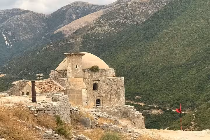 Historic stone structure in the Albanian mountains, showcasing cultural heritage on a private guided tour.