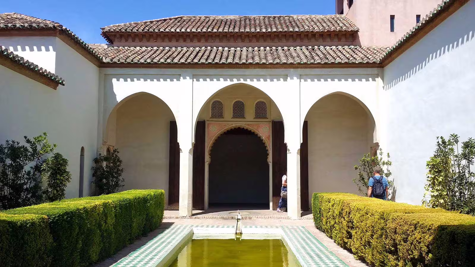 Alcazaba of Malaga courtyard with Moorish arches and reflecting pool on a private full-day tour with hotel pick-up