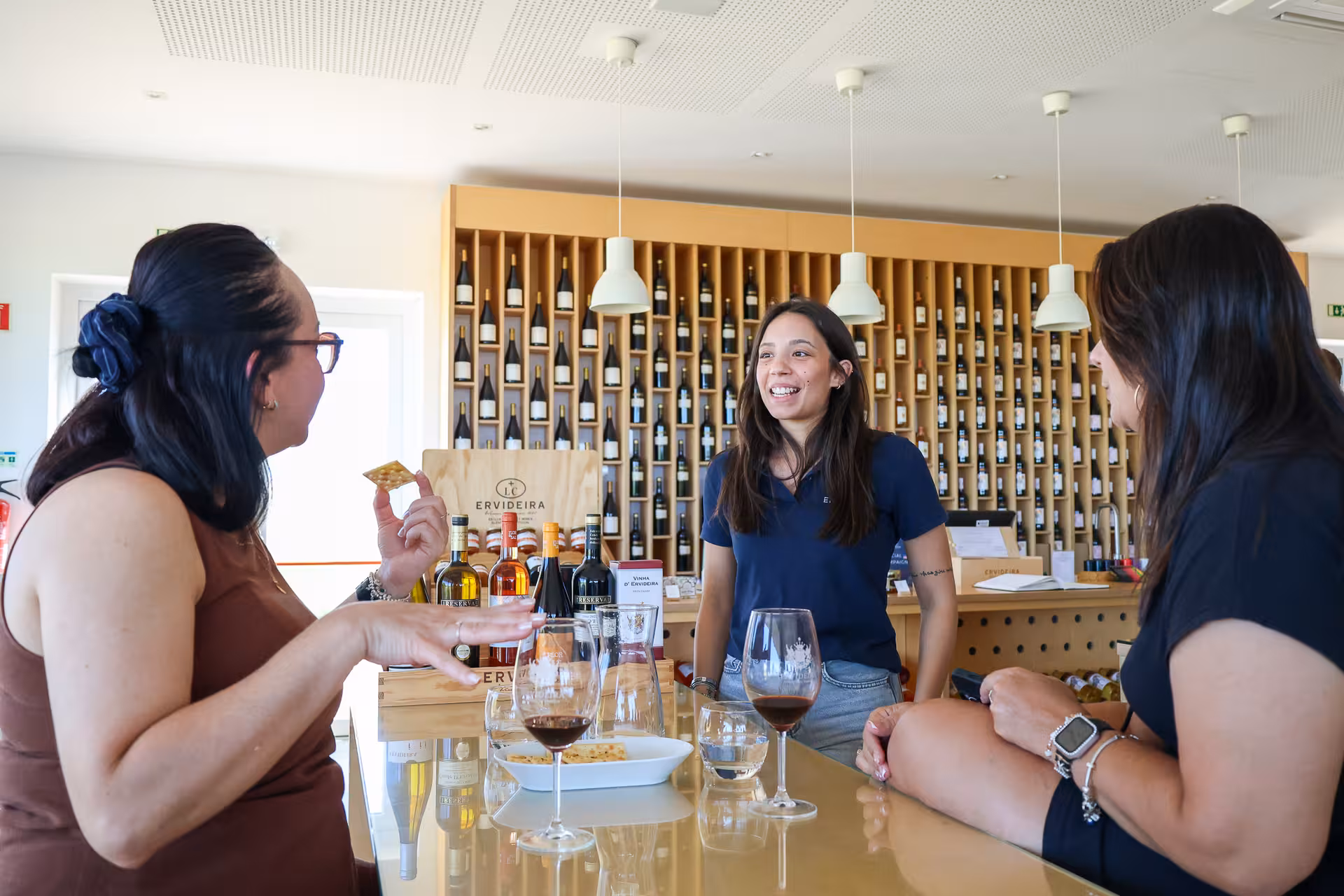 Join a lively Alentejo wine tasting session, engaging with locals and sampling regional wines in a cozy setting.