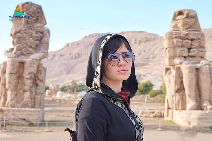 Traveler at Luxor Colossi of Memnon stop on Alexandria to Abu Simbel wheelchair-friendly Egypt itinerary