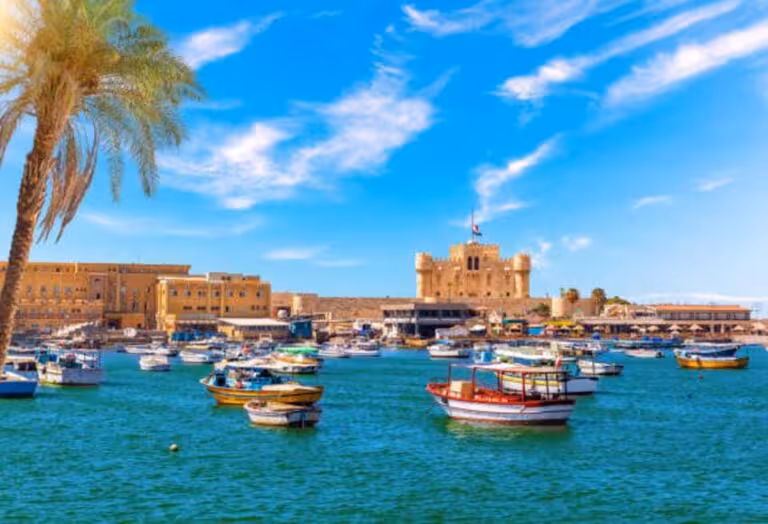 Alexandria harbor with Qaitbay Citadel and colorful boats, highlight of Cairo Alexandria Fayoum 3-day tour