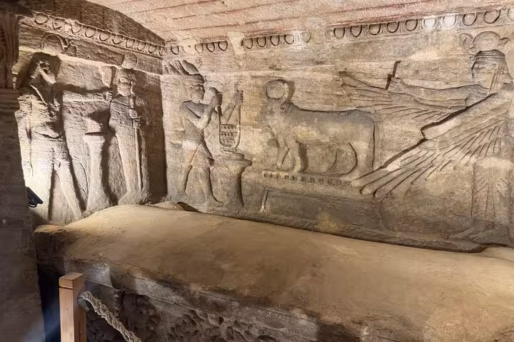 Ancient stone sarcophagus reliefs at Kom El Shoqafa Catacombs on Alexandria private VIP day tour