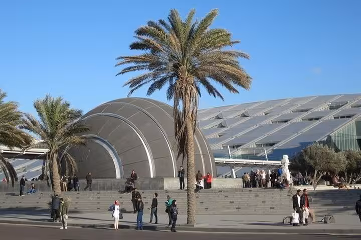 Alexandria Library exterior with palm trees, featured on Cairo to Alexandria tour with tickets and lunch