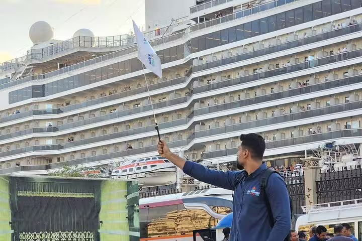 Alexandria Port shore excursion guide greeting cruise guests for a private Giza Pyramids and Sakkara day tour