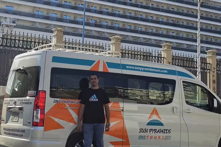 Tour guide meeting by Alexandria Port minibus for National Museum visit, Citadel of Qaitbay stop and bazaar shopping