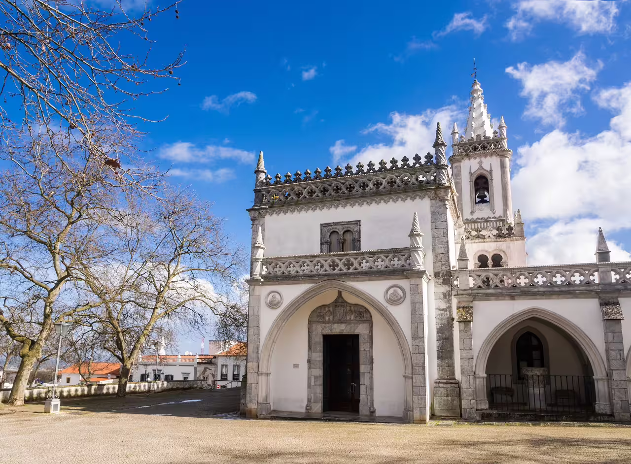 Historic Gothic-style building under a clear blue sky in Algarve and Alentejo self-drive tour experience.