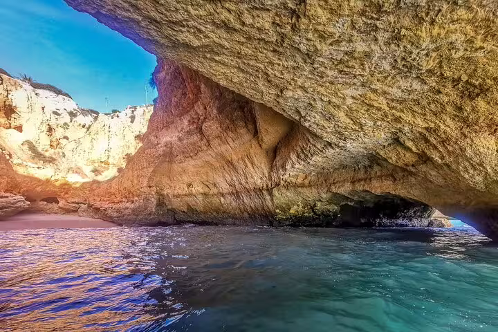 Explore the stunning Benagil Caves on a private Algarve tour from Lisbon, featuring crystal-clear waters and dramatic rock formations.