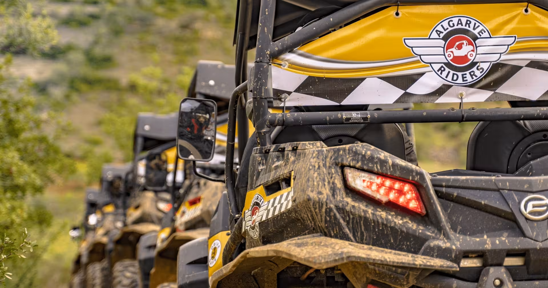 Close-up of Algarve Riders buggy convoy on muddy mountain track, highlighting rugged off-road Algarve buggy tour