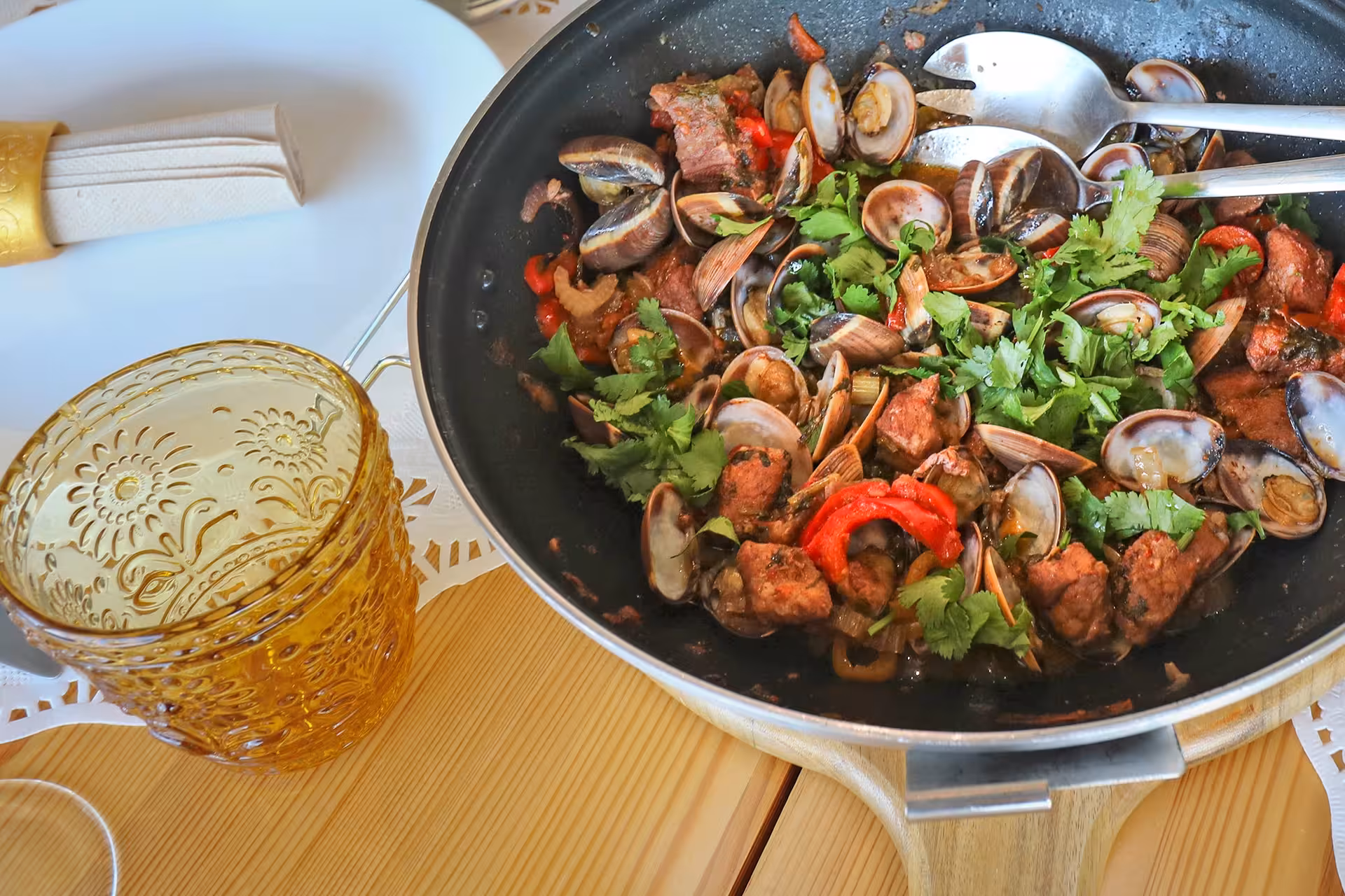 Freshly cooked Algarve cataplana with clams, chorizo, peppers, and cilantro in a private cooking class