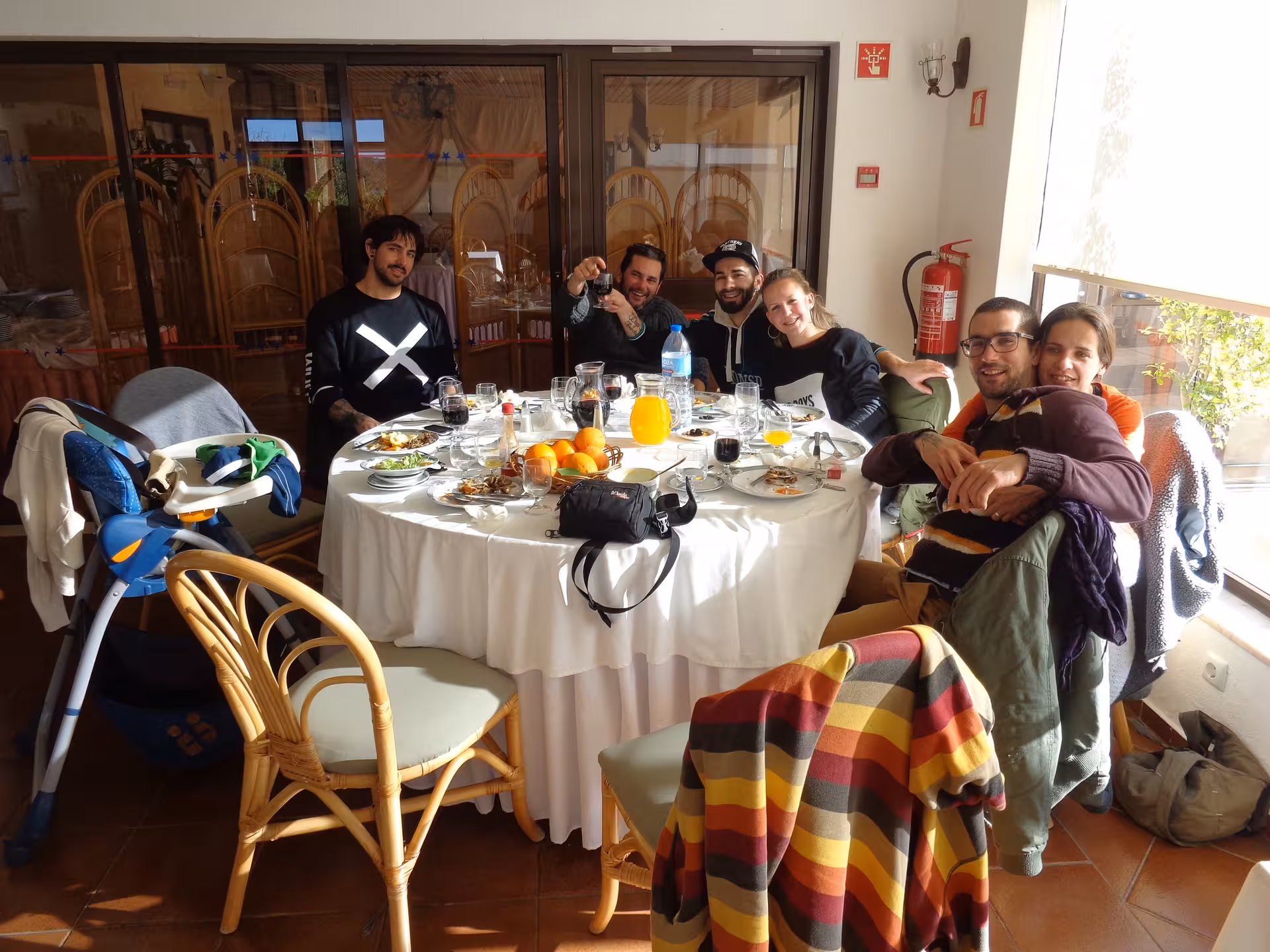 Friends enjoying a relaxed Portuguese lunch with regional dishes and drinks on the Algarve full day Jeep safari experience