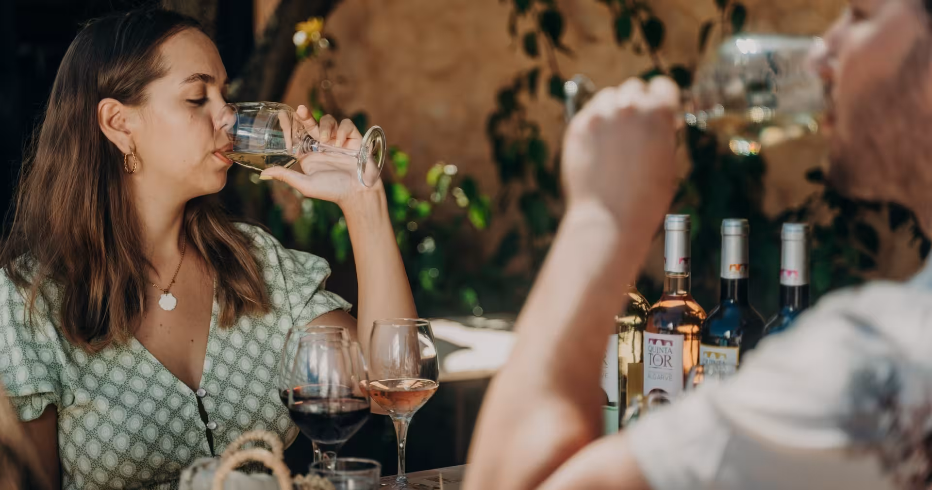 Couple enjoying Algarve wine tasting with Quinta da Tor regional wines included in a Jeep Safari and local tapas tour