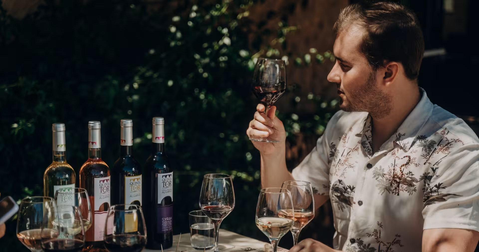Man savoring local Algarve red wine during a guided wine tasting session on an off-road jeep safari tour in Portugal