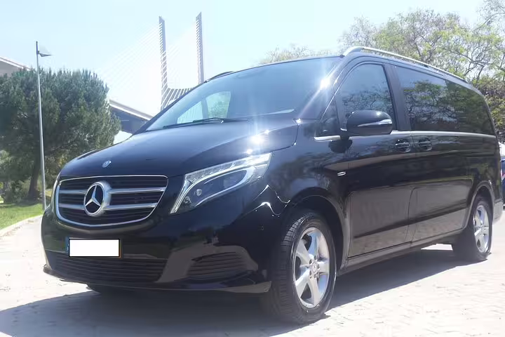 Luxurious black Mercedes minivan for Algarve to Lisbon private journey, offering a comfortable and direct travel experience.