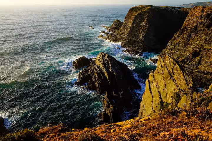Dramatic Atlantic cliffs on Portugal’s west coast, popular stop on Algarve to Lisbon private transfer