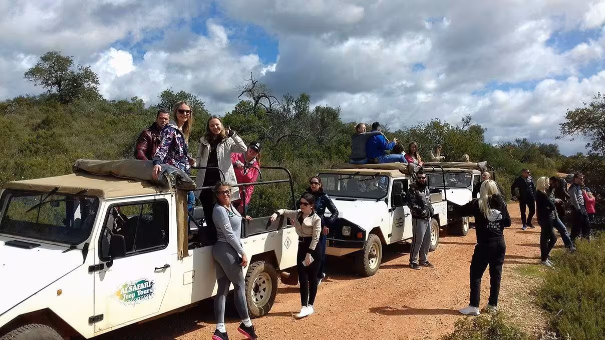 Friends on open-top jeeps enjoy an Algarve countryside safari before a romantic sunset sparkling wine experience