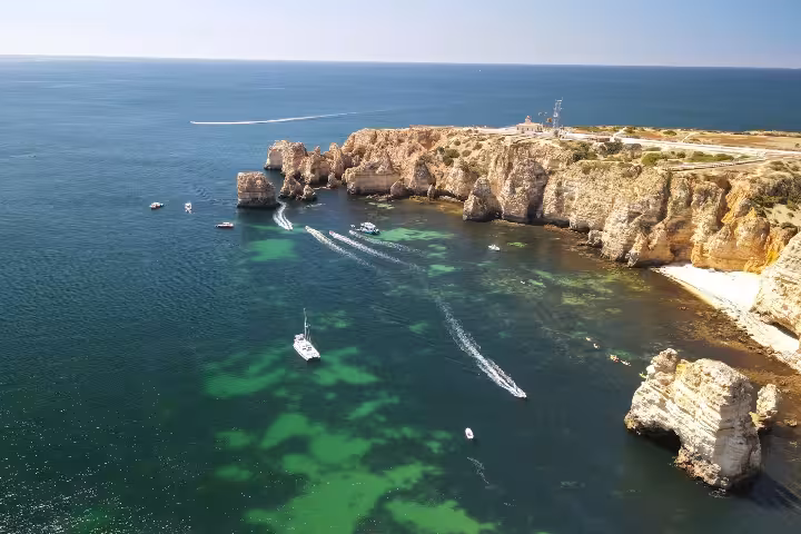 Aerial view of Algarve sea cliffs and turquoise coves, ideal for Sailor for a Week sailing adventure