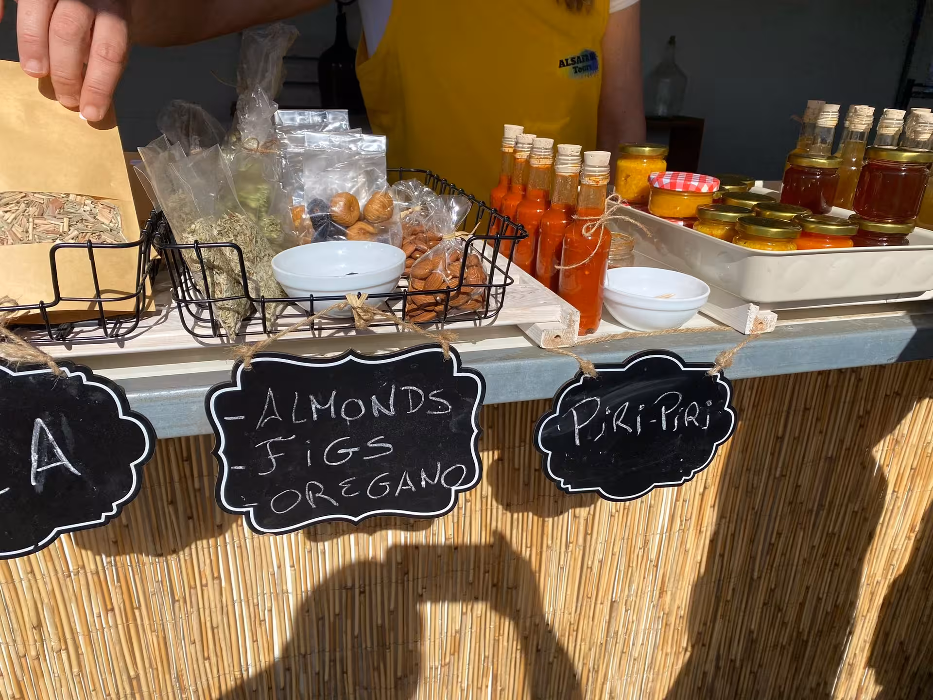 Selection of Algarve almonds, figs, herbs, piri-piri sauces and local honey at farm tasting on sunset Jeep safari