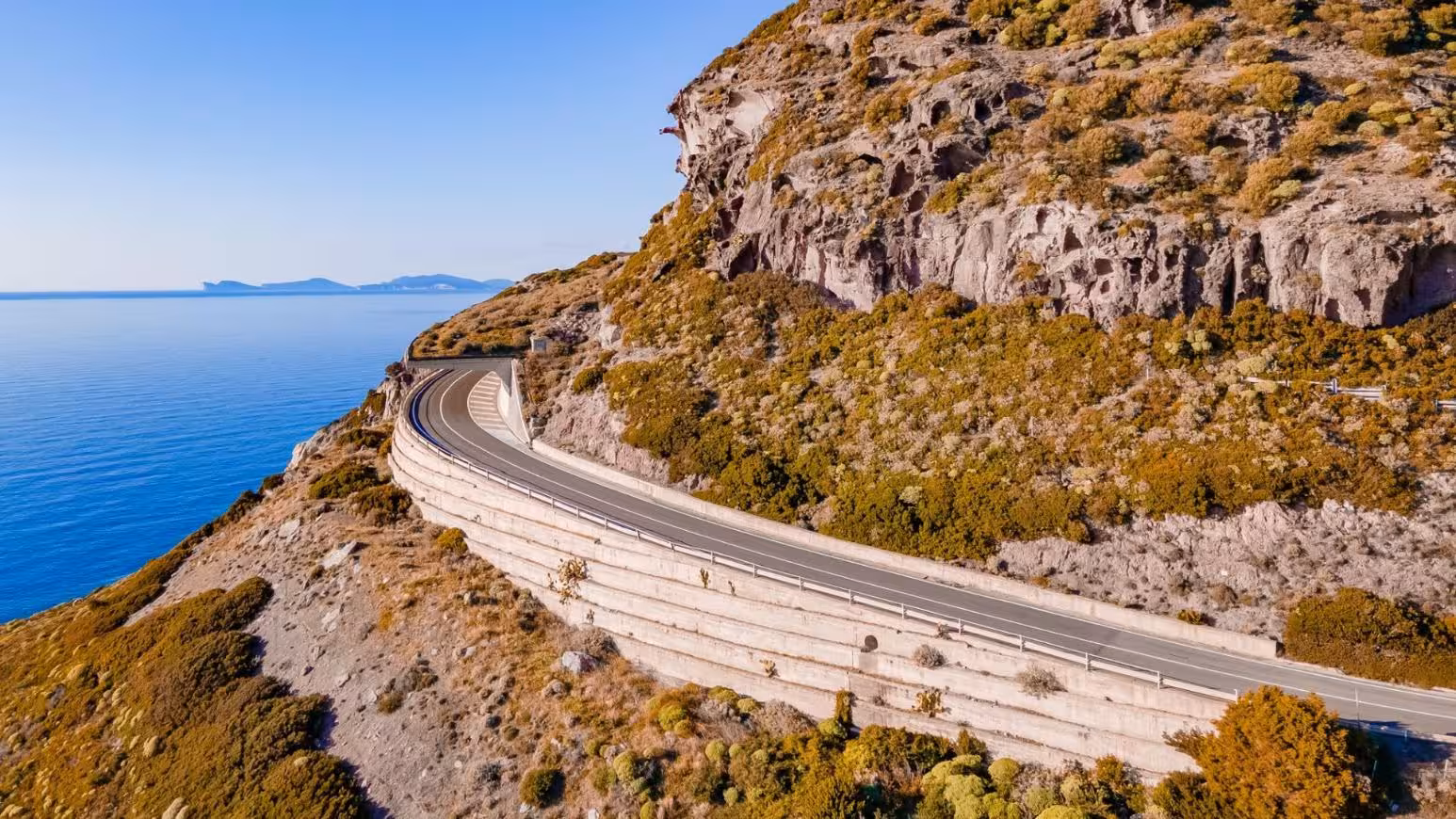 Scenic coastal road near Alghero with breathtaking sea views on the way to the panoramic tour of Bosa.