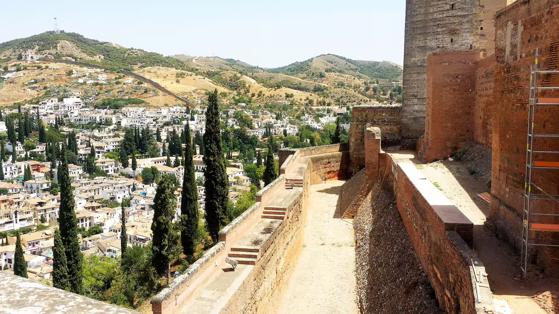View from Alhambra fortress walls over Granada and hills, a highlight of a private Alhambra walking tour