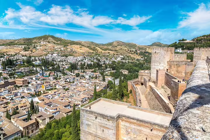 Stunning view of Alhambra's historic architecture and Granada's scenic landscape on a cruise-exclusive tour from Malaga.