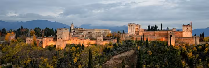 Scenic view of the Alhambra in Granada at dusk, a highlight of the Granada, Toledo & Madrid 2-day tour from Costa del Sol.