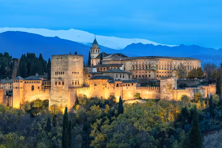 Majestic Alhambra Palace in Granada at dusk, a highlight of the 5-day Andalucia tour from Costa del Sol.
