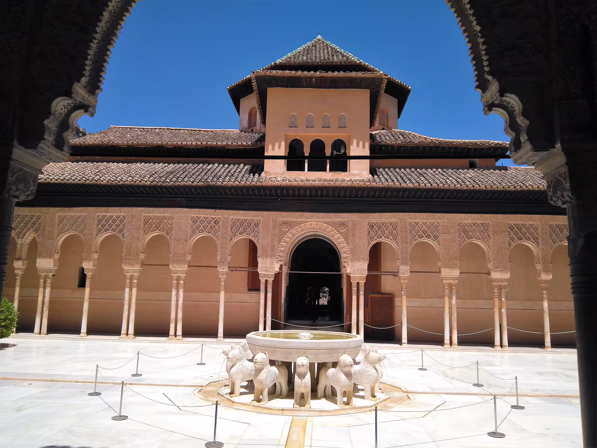 Patio of the Lions courtyard with famous fountain at Alhambra, Granada, on a small-group walking tour