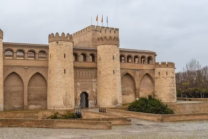 Explore the historic Aljafería Palace on a private 2-hour city walk in Zaragoza with a local guide.
