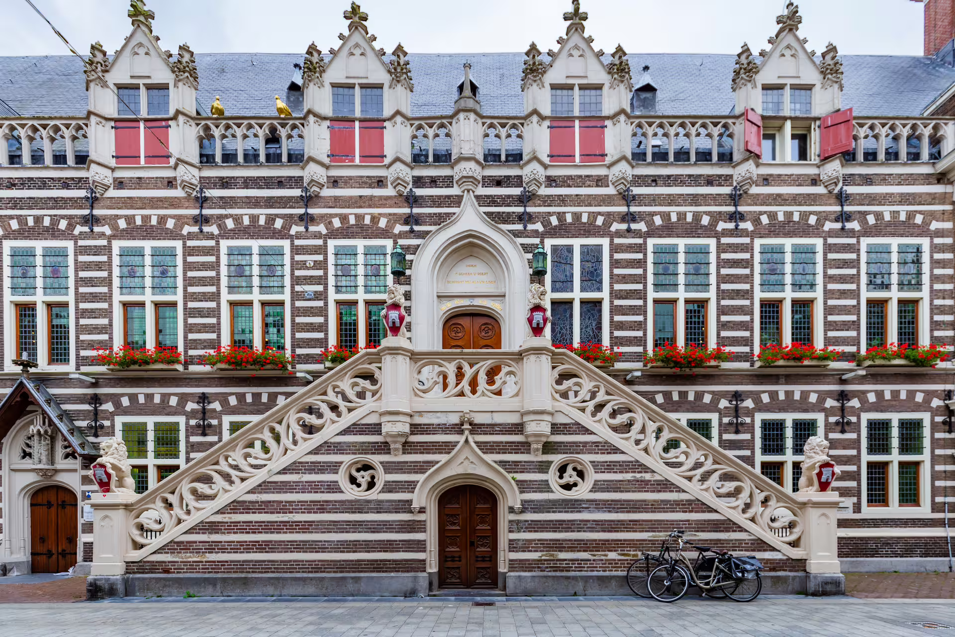 Alkmaar city hall facade in Netherlands on 1-day walking tour with multilingual audioguide, Gothic details