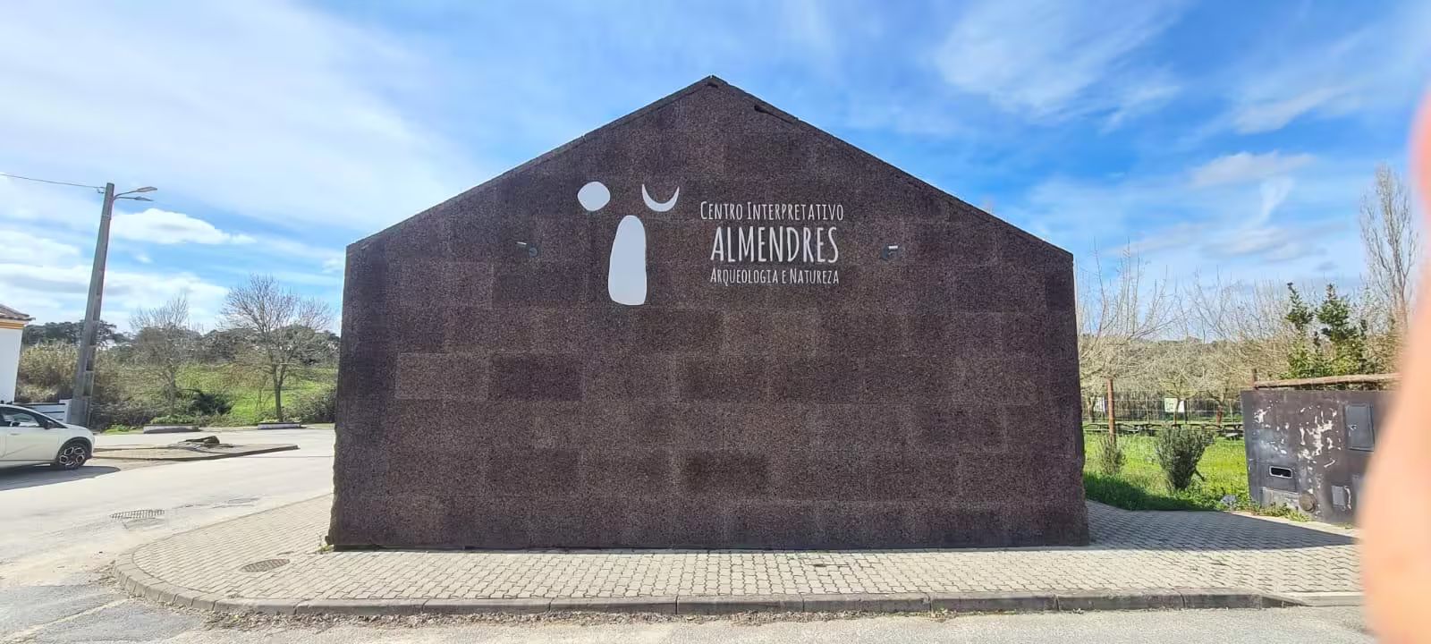 Exterior view of Almendres Interpretive Center, a key site for archaeological exploration in Évora, Portugal.