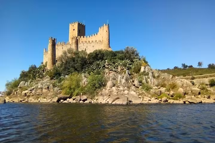 Close-up of the medieval Almourol Castle perched on a rocky island, featured in the Templars private tour.