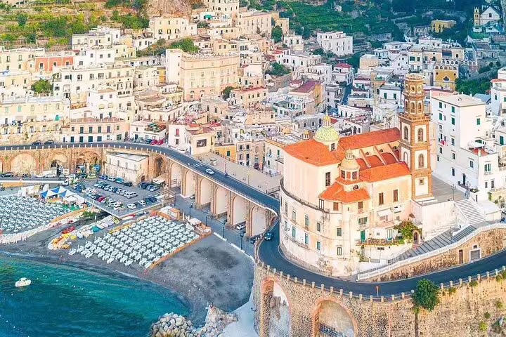 Aerial view of Atrani village on the Amalfi Coast with colorful cliffside buildings and church