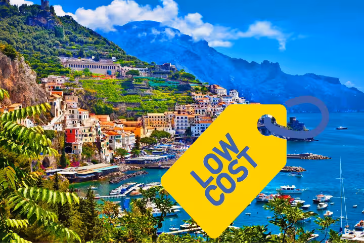 Amalfi Coast panoramic view with harbor and cliffside town, low cost Naples to Amalfi excursion deal