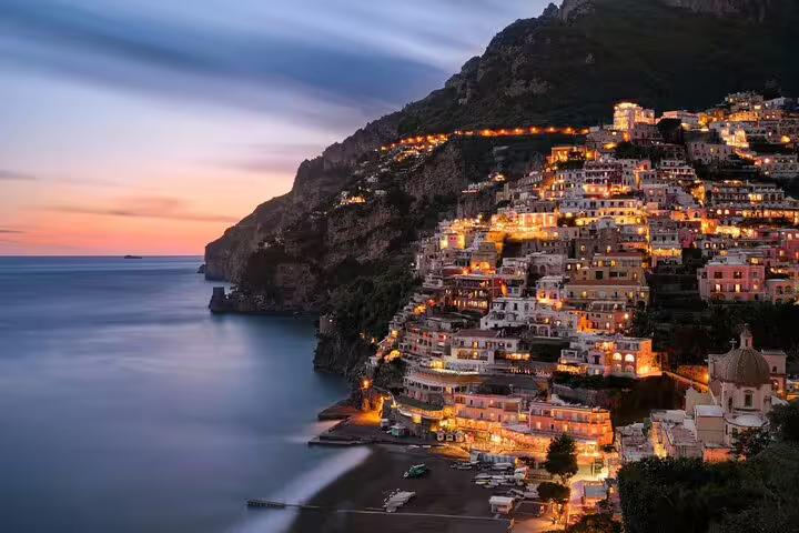 Positano cliffside village glowing at sunset on the Amalfi Coast, Italy