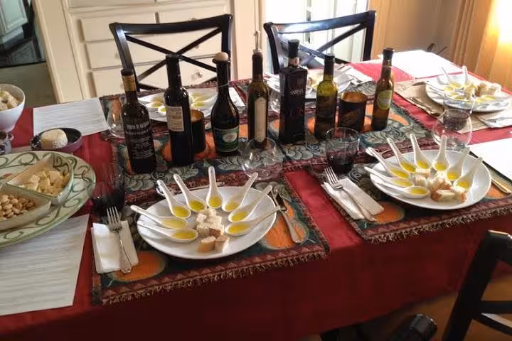 Italian dining setup with olive oil tasting, showcasing authentic culinary experiences on Amalfi, Positano, Sorrento tour.